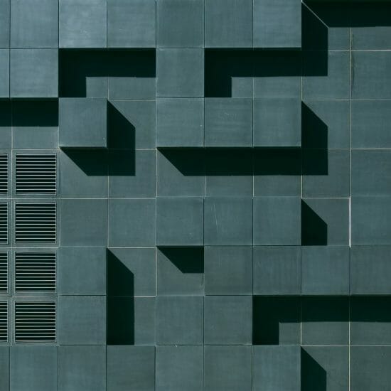Gray concrete building exterior with geometric design