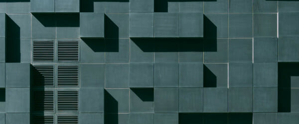Gray concrete building exterior with geometric design